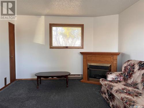 609 B Avenue W, Wynyard, SK - Indoor Photo Showing Other Room With Fireplace
