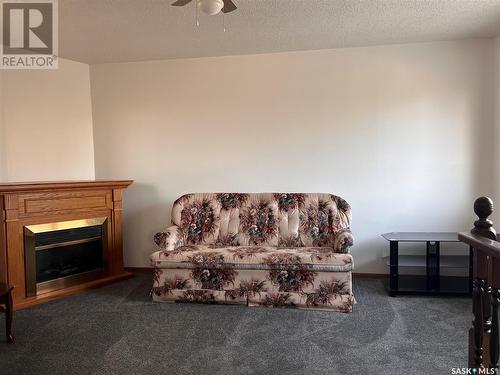 609 B Avenue W, Wynyard, SK - Indoor Photo Showing Living Room With Fireplace
