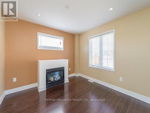 10 Nieuwendyk Street, Whitby, ON - Indoor Photo Showing Living Room With Fireplace