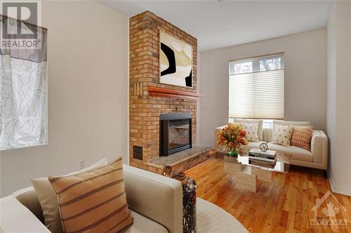 Virtually Staged - 116 Primrose Avenue, Ottawa, ON - Indoor Photo Showing Living Room With Fireplace