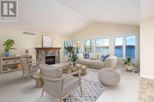 This photo has been virtually staged. - 115 South Shores Road, Grey Highlands, ON - Indoor Photo Showing Living Room With Fireplace