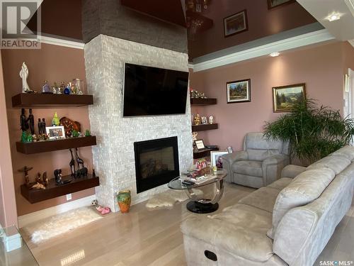 8709 Kestral Drive, Regina, SK - Indoor Photo Showing Living Room With Fireplace