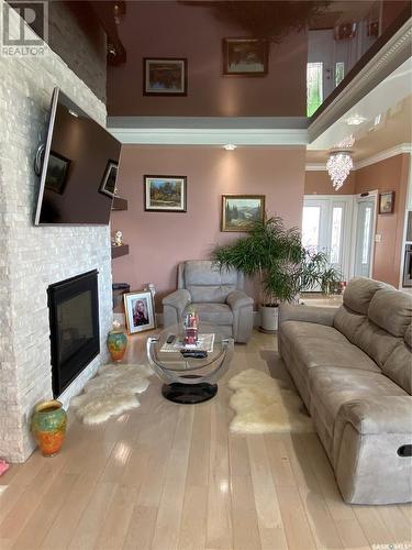 8709 Kestral Drive, Regina, SK - Indoor Photo Showing Living Room With Fireplace
