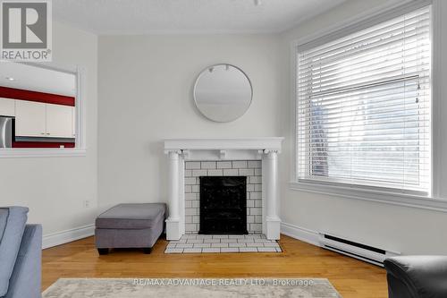 #407 -460 Wellington St, London, ON - Indoor Photo Showing Living Room With Fireplace