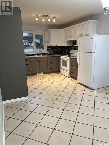 302 Perkins Street, Estevan, SK - Indoor Photo Showing Kitchen With Double Sink