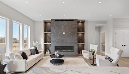 36 Oak Bridge Way, East St Paul, MB - Indoor Photo Showing Living Room With Fireplace