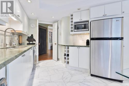 #405 -18 Lower Village Gate, Toronto, ON - Indoor Photo Showing Kitchen With Double Sink