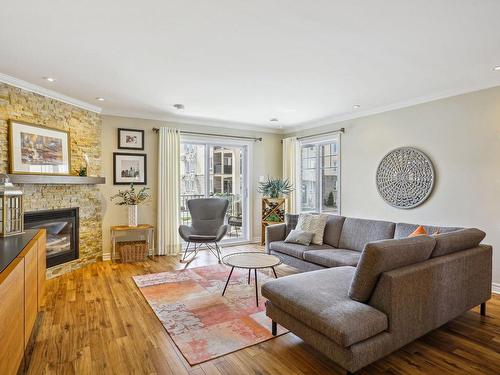 Salon - 202-235 Rue Bohémier, Mascouche, QC - Indoor Photo Showing Living Room With Fireplace