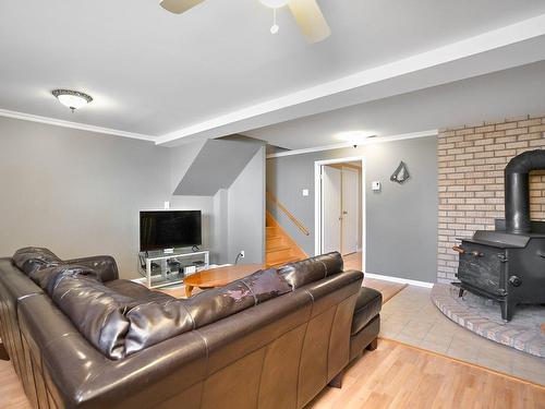 Salle familiale - 5647 Rue Auclair, Brossard, QC - Indoor Photo Showing Other Room With Fireplace