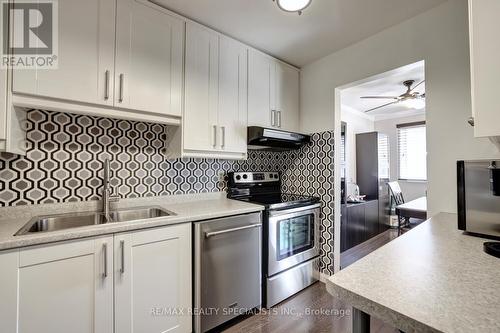 #56 -5005 Pinedale Ave, Burlington, ON - Indoor Photo Showing Kitchen With Stainless Steel Kitchen With Double Sink
