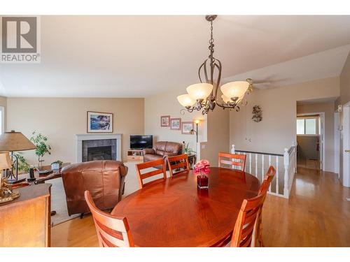 6408 Harrison Heights, Summerland, BC - Indoor Photo Showing Dining Room With Fireplace