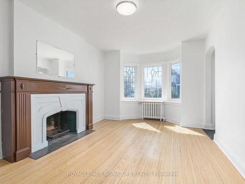 316 Cosburn Ave, Toronto, ON - Indoor Photo Showing Living Room With Fireplace