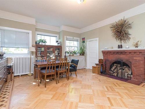 1032 Verrinder Ave, Victoria, BC - Indoor Photo Showing Dining Room With Fireplace