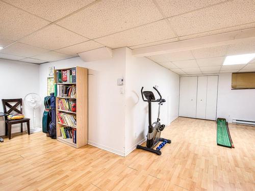 Family room - 990 Rue Pesant, Laval (Sainte-Dorothée), QC - Indoor Photo Showing Gym Room