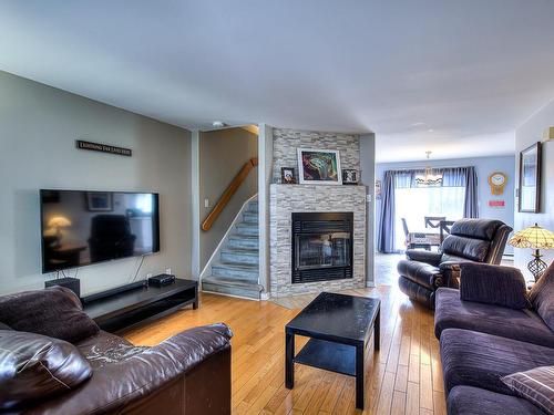 Overall view - 990 Rue Pesant, Laval (Sainte-Dorothée), QC - Indoor Photo Showing Living Room With Fireplace