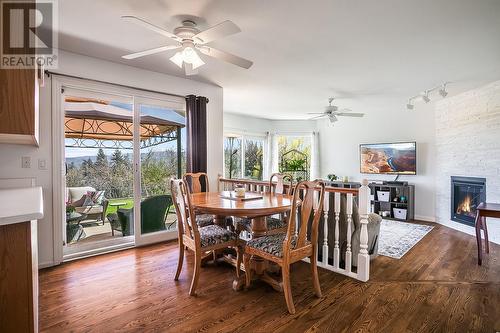 3473 Gates Road, West Kelowna, BC - Indoor Photo Showing Dining Room With Fireplace