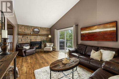 1004 Rocky Shore Lane, South Frontenac, ON - Indoor Photo Showing Living Room With Fireplace