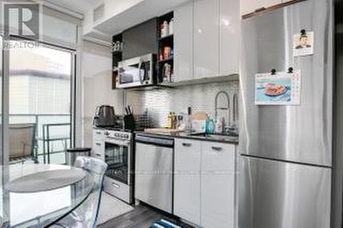 #413 -10 De Boers Dr, Toronto, ON - Indoor Photo Showing Kitchen With Stainless Steel Kitchen With Upgraded Kitchen