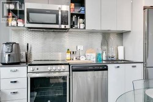 #413 -10 De Boers Dr, Toronto, ON - Indoor Photo Showing Kitchen With Upgraded Kitchen