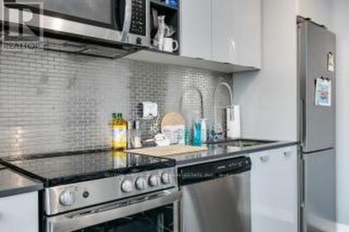 #413 -10 De Boers Dr, Toronto, ON - Indoor Photo Showing Kitchen With Stainless Steel Kitchen