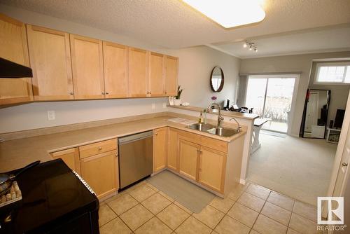 #4 1179 Summerside Dr Sw, Edmonton, AB - Indoor Photo Showing Kitchen With Double Sink