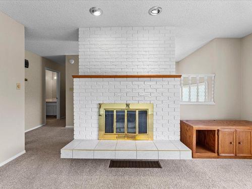 1276 Rio Drive, Kelowna, BC - Indoor Photo Showing Other Room With Fireplace