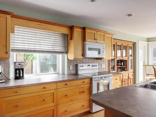 558 Middleton Way, Coldstream, BC - Indoor Photo Showing Kitchen With Double Sink