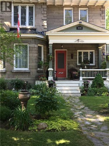Stone home with welcoming porch and flagstone walkway - 536 St Lawrence Street, Winchester, ON - Outdoor