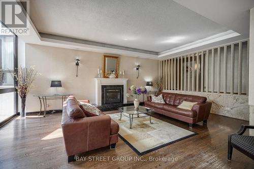 1710 - 1333 Bloor Street N, Mississauga, ON - Indoor Photo Showing Living Room With Fireplace