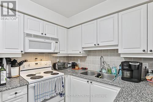 #524 -80 Harrison Garden Blvd, Toronto, ON - Indoor Photo Showing Kitchen With Double Sink
