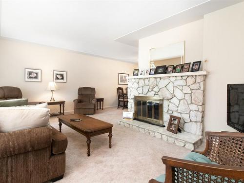 215 Sadler Road, Kelowna, BC - Indoor Photo Showing Living Room With Fireplace