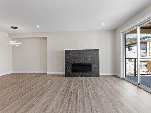 1682 Harbour View Crescent, Kelowna, BC - Indoor Photo Showing Living Room With Fireplace