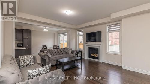 127 Russell Creek Dr, Brampton, ON - Indoor Photo Showing Living Room With Fireplace