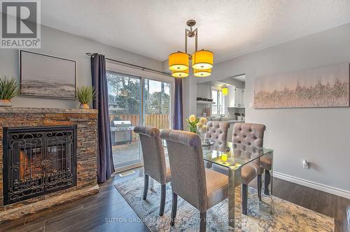 #224 -230 Clarke Rd, London, ON - Indoor Photo Showing Dining Room With Fireplace