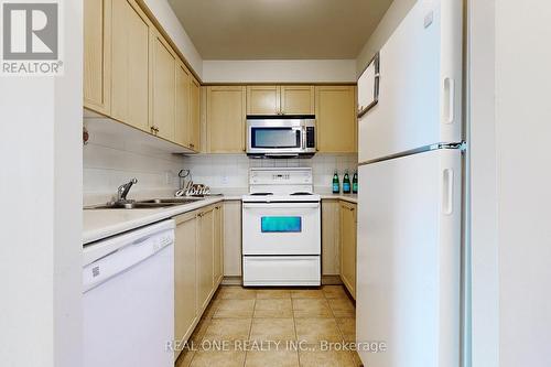 #1704 -4879 Kimbermount Ave, Mississauga, ON - Indoor Photo Showing Kitchen With Double Sink
