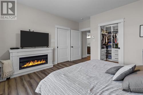 24 Parkside Crescent, Clarenville, NL - Indoor Photo Showing Bedroom With Fireplace