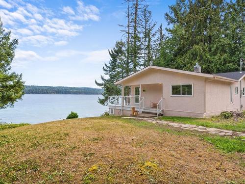 7770 Ships Point Rd, Fanny Bay, BC - Outdoor With Body Of Water With Deck Patio Veranda