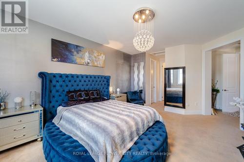 7 Legendary Circle, Brampton, ON - Indoor Photo Showing Bedroom With Fireplace