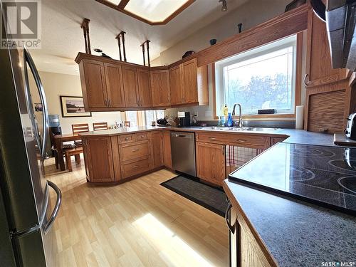 302 Centre Avenue, Meadow Lake, SK - Indoor Photo Showing Kitchen With Double Sink