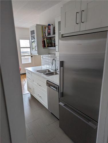 14 Norris Place|Unit #304, St. Catharines, ON - Indoor Photo Showing Kitchen With Double Sink