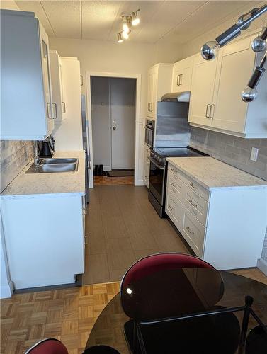 14 Norris Place|Unit #304, St. Catharines, ON - Indoor Photo Showing Kitchen With Double Sink