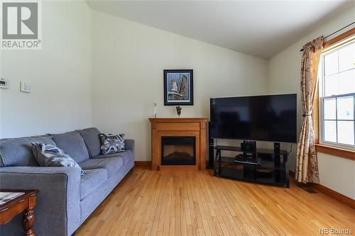 32 Mcgraw Road, Bains Corner, NB - Indoor Photo Showing Living Room With Fireplace