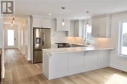 Kitchen photo from previous unit by builder - 