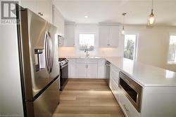 Kitchen photo from previous unit by builder - 