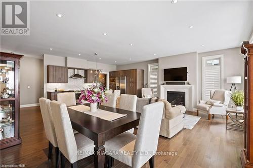 #1 -5622 Ironwood St, Niagara Falls, ON - Indoor Photo Showing Dining Room With Fireplace