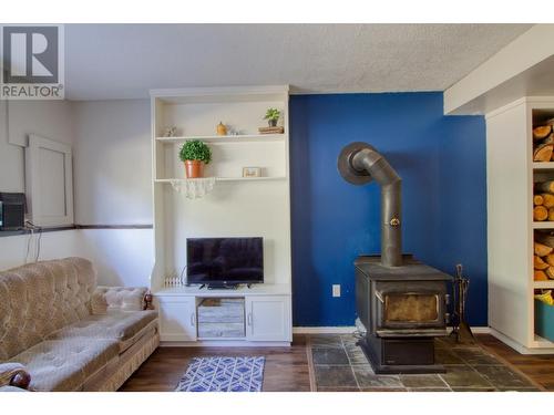5085 Easzee Drive, 108 Mile Ranch, BC - Indoor Photo Showing Living Room With Fireplace