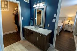 Ensuite leads to a huge walk-in closet - 