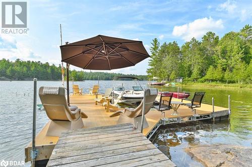 660 Thirty Island Road, Cloyne, ON - Outdoor With Body Of Water With Deck Patio Veranda