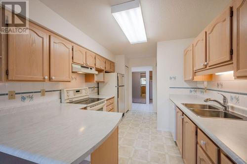 195 Warren Avenue Unit# 408, Penticton, BC - Indoor Photo Showing Kitchen With Double Sink