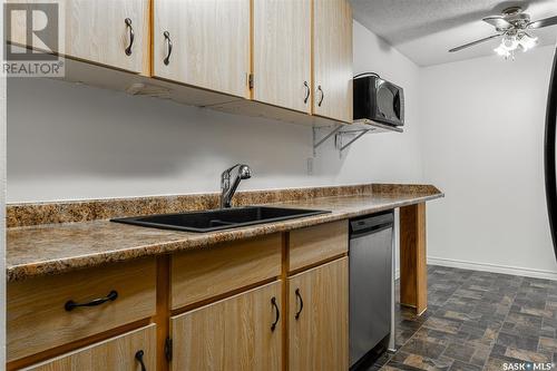 738 310 Stillwater Drive, Saskatoon, SK - Indoor Photo Showing Kitchen With Double Sink